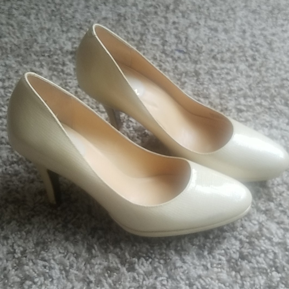 Cole Haan cream patent pumps